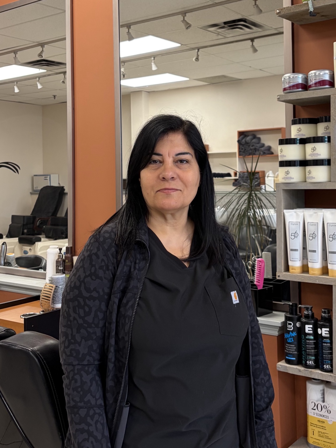 Shamiran, hairstylist with 15+ years of experience, professional salon portrait